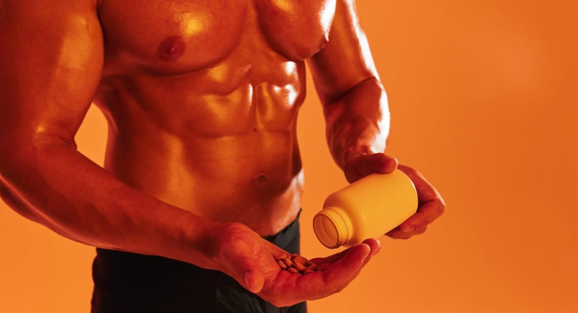 Man bodybuilder boxer with naked torso with abs holding a can of muscle growth pills, steroids, doping, protein. Advertising, sports, active lifestyle, colored yellow light, competition, challenge concept. . High quality photo