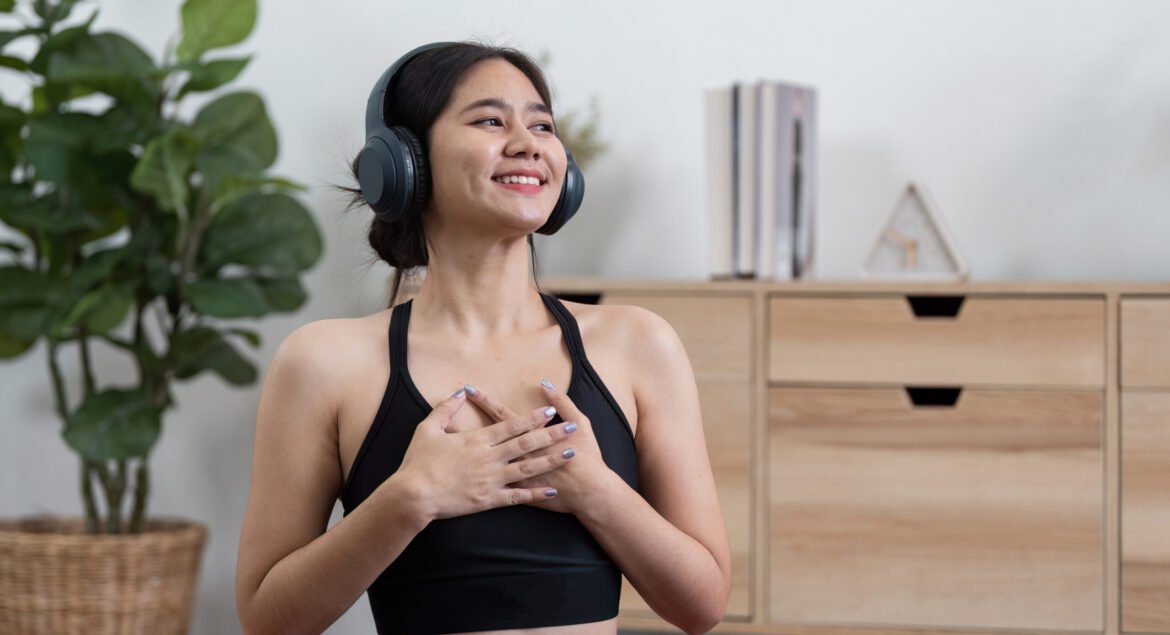 A serene moment of mindfulness and relaxation as a young woman enjoys music at home, embodying the essence of wellness.